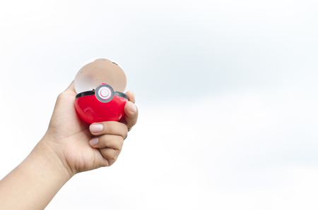 BANGKOK,THAILAND-September 29, 2016 : Pokeball on white backgrond Pokeball is equipment to catch Pokemons in a mobile game Pokemon Go.のeditorial素材