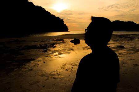 Silhouette Man on beach in Thailandの写真素材