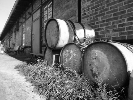 Old barrels against the wallの写真素材