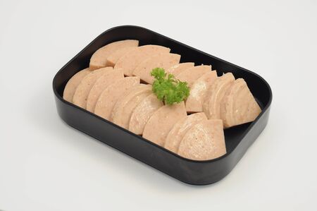 Slices of Luncheon meat in a plateの写真素材
