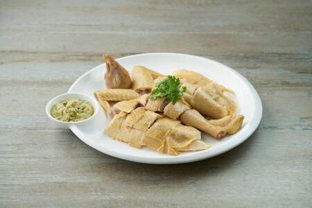 steamed chicken with garlic & ginger sauceの写真素材