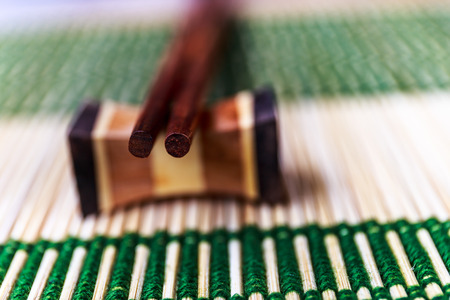 Chopsticks on the bamboo matの写真素材