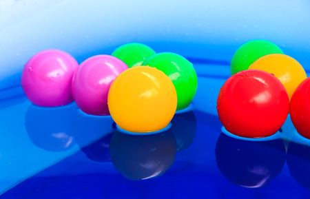 Color balls float on the poolの写真素材