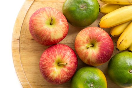 Apple, Orange and banana on the wood trayの写真素材