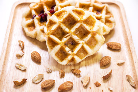 Almond, nut and cranberry waffle on the plateの写真素材