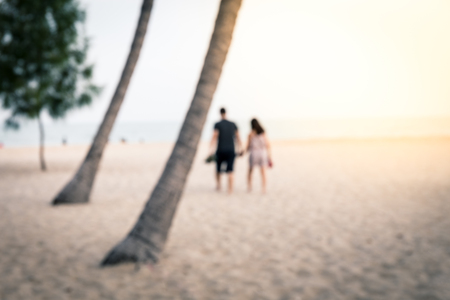 Blur, Boyfriend and girlfriend hold hand and walking on the beachの写真素材