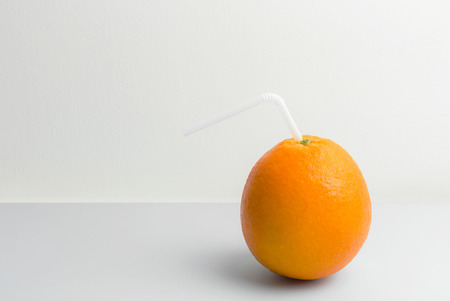 Fresh orange fruit on the table with white backgroundの写真素材