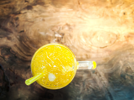 Yellow juice made from chrysanthemum flower on the tableの写真素材