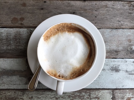 Coffee on white cup, top viewの素材