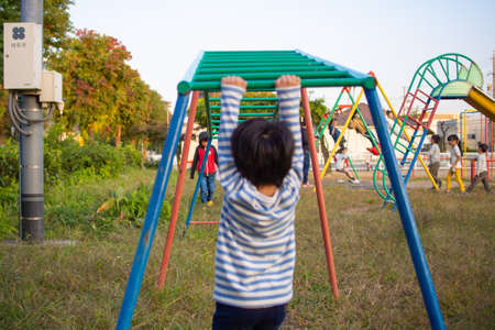 Japanese boy playing in a park in Gifu City, Gifu Prefectureの写真素材