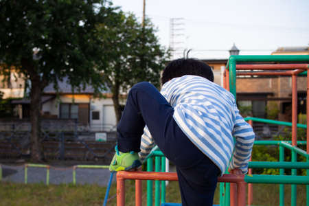 Japanese boy playing in a park in Gifu City, Gifu Prefectureの写真素材
