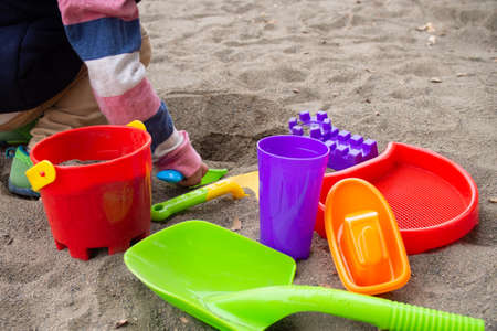 Japanese children playing in the sandbox (kindergarten children)の写真素材