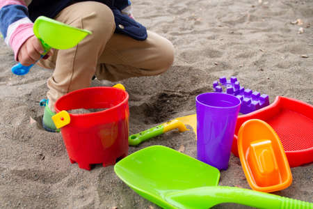 Japanese children playing in the sandbox (kindergarten children)の写真素材