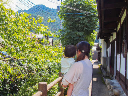 Japanese parents and children walking in Gujo City, Gifu Prefectureの写真素材