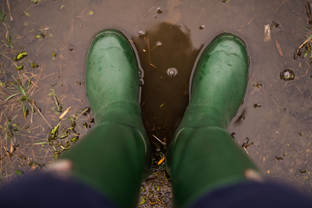 rain behind a window. rain drops on glass. cars on the road. heavy rainの写真素材