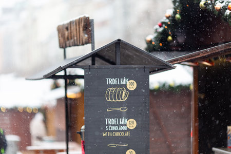 PRAGUE, Czech Republic - DECEMBER 12th 2022: TrdelnÃ­k stall on Wenceslas Square, winter time under snowのeditorial素材