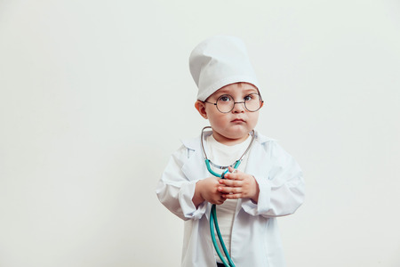 A child dressed in a doctor suitの写真素材