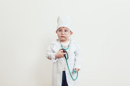 A child dressed in a doctor suitの写真素材