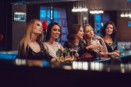 Beautiful girls having fun at a party in nightclubの写真素材