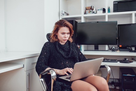 the young business woman with a computer in the office