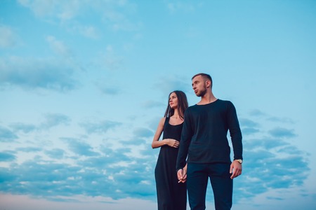 The guy with the girl at sunsetの写真素材