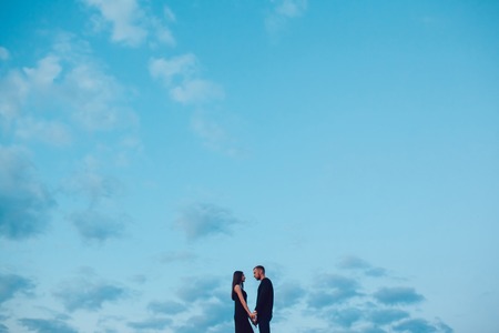 The guy with the girl at sunsetの写真素材