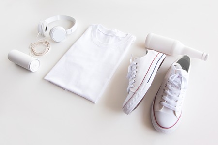 Blank stuff on white background. Template for design presentations. Branding Mock-Up. Shirt, sneakers, headphones, bottle.の写真素材