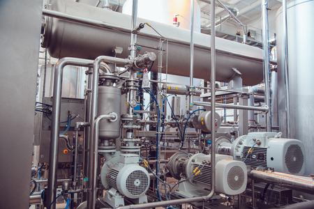 Modern beer plant, with brewing kettles, vessels, tubs and pipes made of stainless steel. Brewery.の写真素材