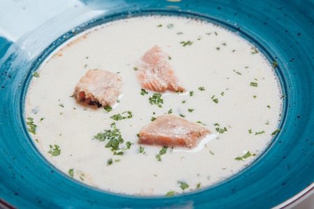 Cream soup with salmon fillet.の写真素材