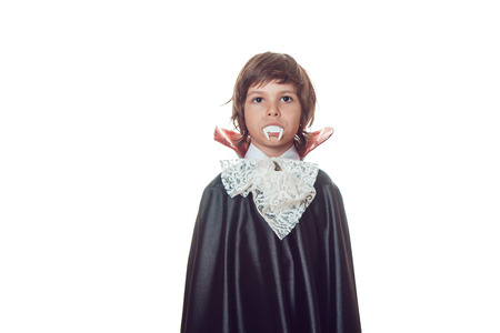 Boy in scary Hallowe'en costumes isolated on white. Dracula.