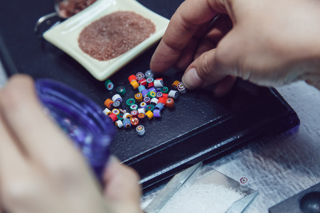 Process of manufacturing costume jewelery from Venetian glass.