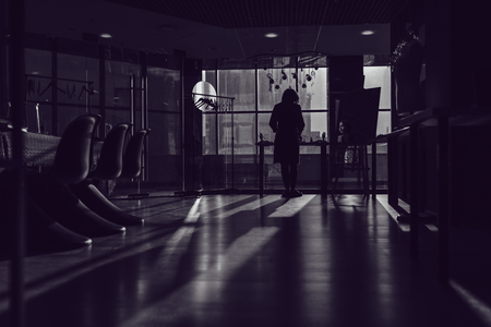 A woman arranges costume jewelry in her workshop.の写真素材