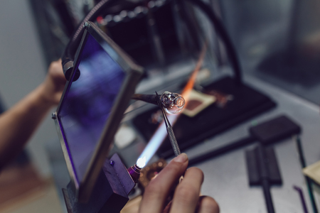 Process of manufacturing costume jewelery from Venetian glass.の写真素材