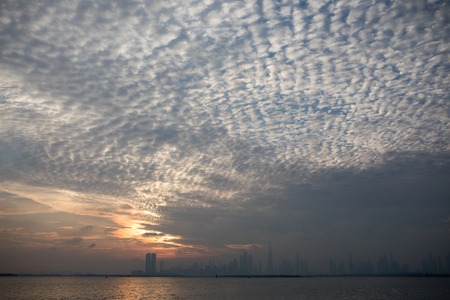 View of Dubai in cloudy weather at sunset.の写真素材