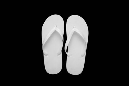 Blank white flip flops on a black cutted background. Mock-up.の写真素材