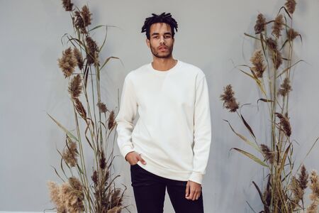 African american man wearing white blank sweatshirt. Mock-up.の写真素材