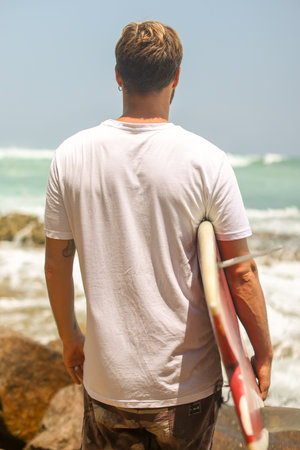 A Surfer Getting Excited and Prepared to Catch a Perfect Wave at the Beautiful Beach on a Sunny Day