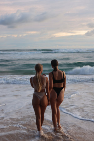 Experience the enchanting Sunset Beach Vibes while enjoying time with close friendsの写真素材