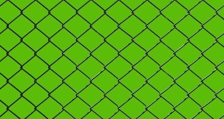 iron wire fence isolated on green backgroundの写真素材
