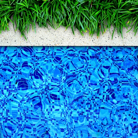 Fresh green grass on pool edge backgroundの写真素材