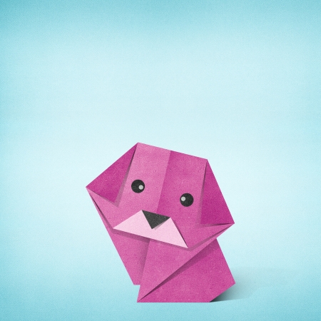 Origami dog recycled paper backgroundの写真素材