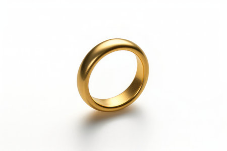 a yellow wedding ring on a white backgroundの素材