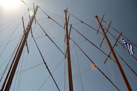 Detail of the masts of a sailboat against the blue skyの写真素材