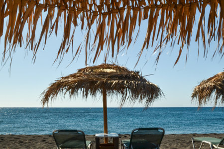 Beach umbrellas and sun loungers on the beachの写真素材
