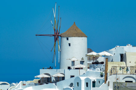 Windmill in Oia town on Santorini island, Greeceの写真素材