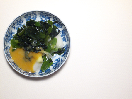 Sweet white miso sauce of seaweed and Leek appetizerの写真素材