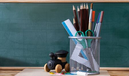 Back to school concept. colored pencil, and supplies  on wooden tableの写真素材