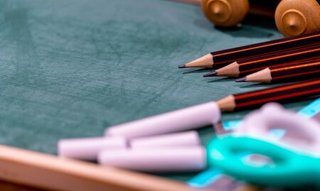 Back to school concept. colored pencil, and supplies  on wooden table