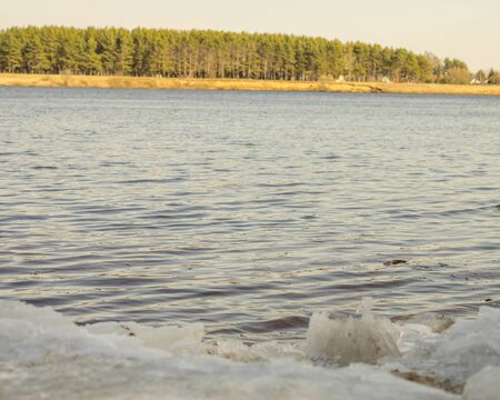 river Bank with ice family fishing