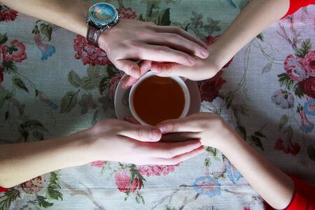 Cup drink for Breakfast in the hands of lovers. Selective focus. Nature.の写真素材